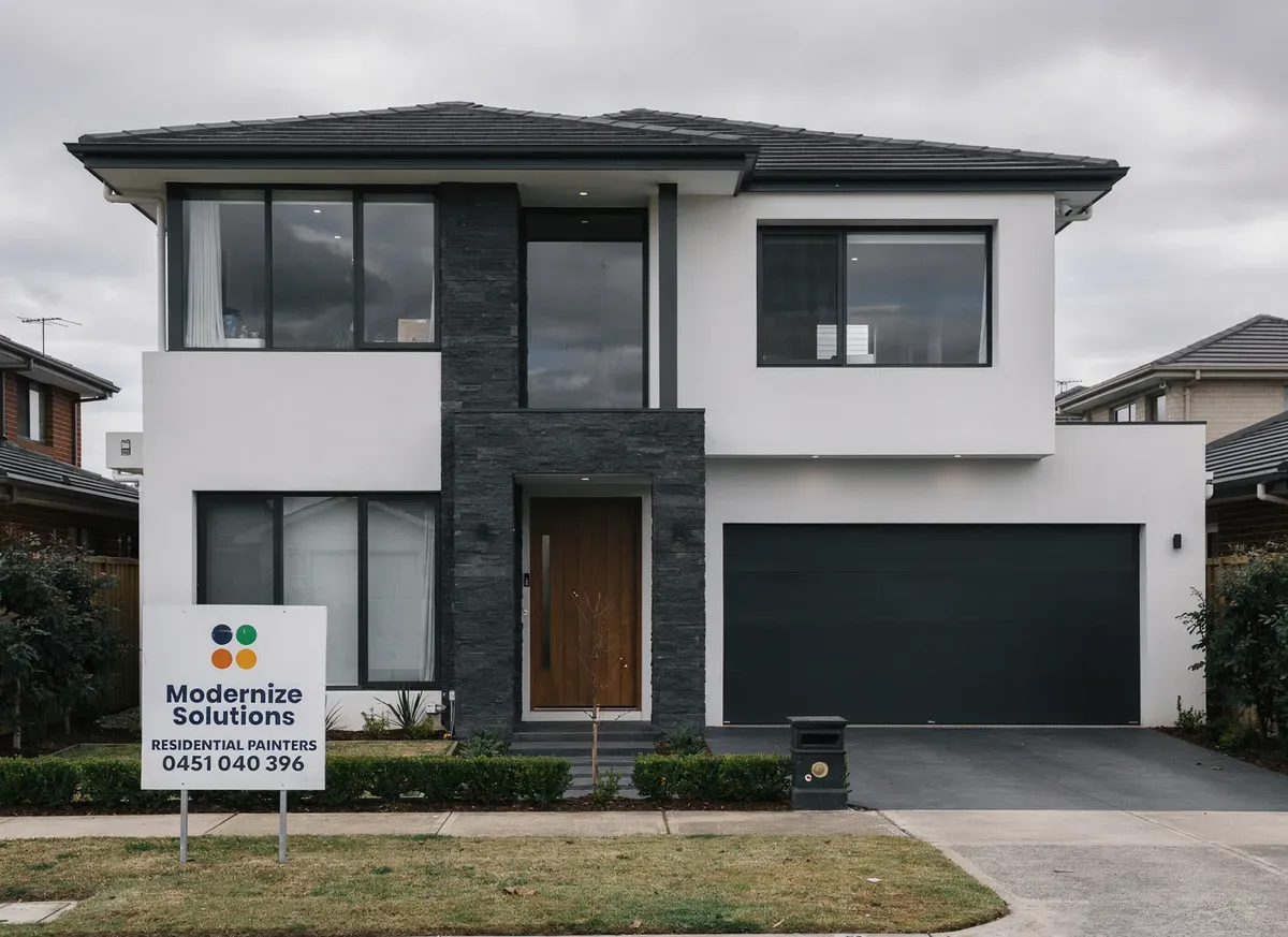 Modernize Solutions advertising sign in front of a newly painted Melbourne home
