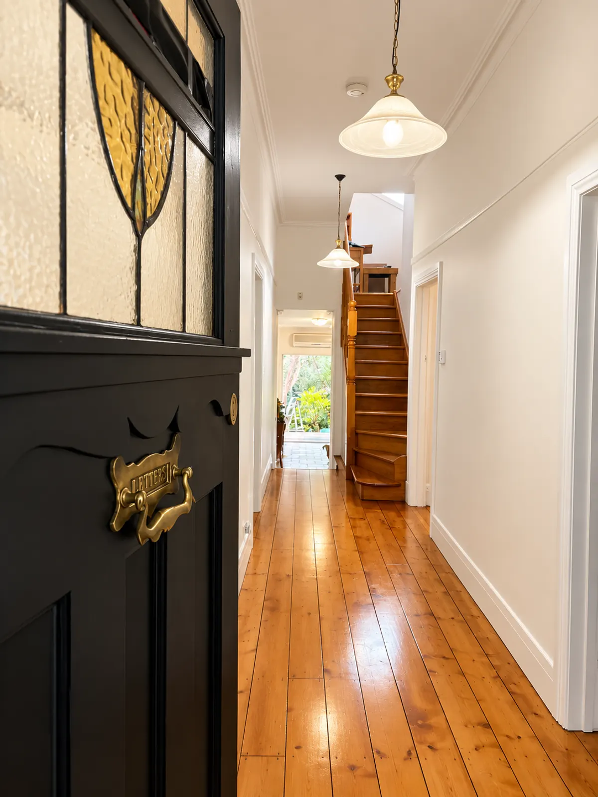 Freshly painted white hallway with heritage front door, interior painting by Modernize Solutions, Braybrook